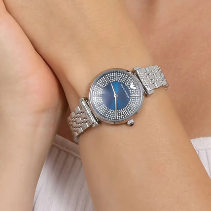 Emporio Armani Gianni T-Bar women's watch worn on wrist showing blue crystal dial and silver bracelet