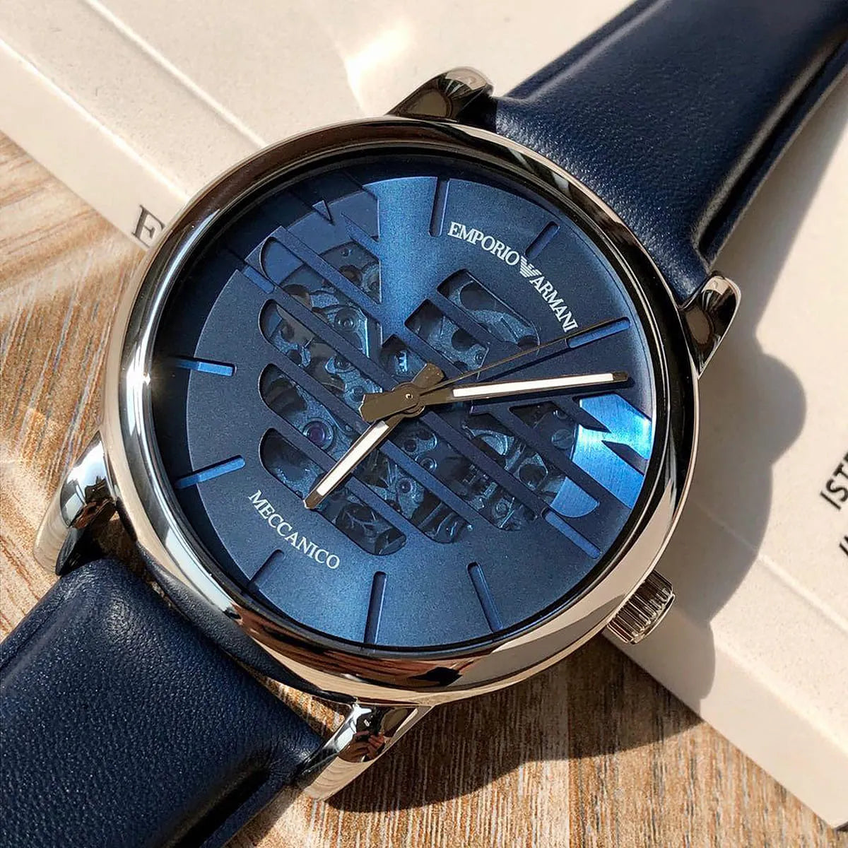 Emporio Armani Luigi skeleton dial detail showing blue sunray face with visible movement and indices