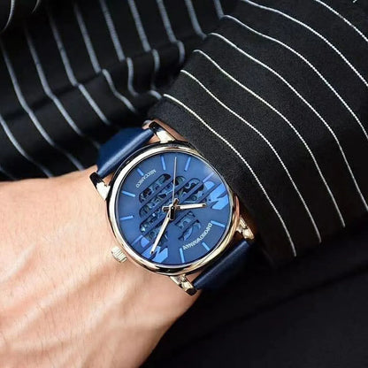 Emporio Armani Luigi watch worn on wrist showing blue skeleton dial and leather strap