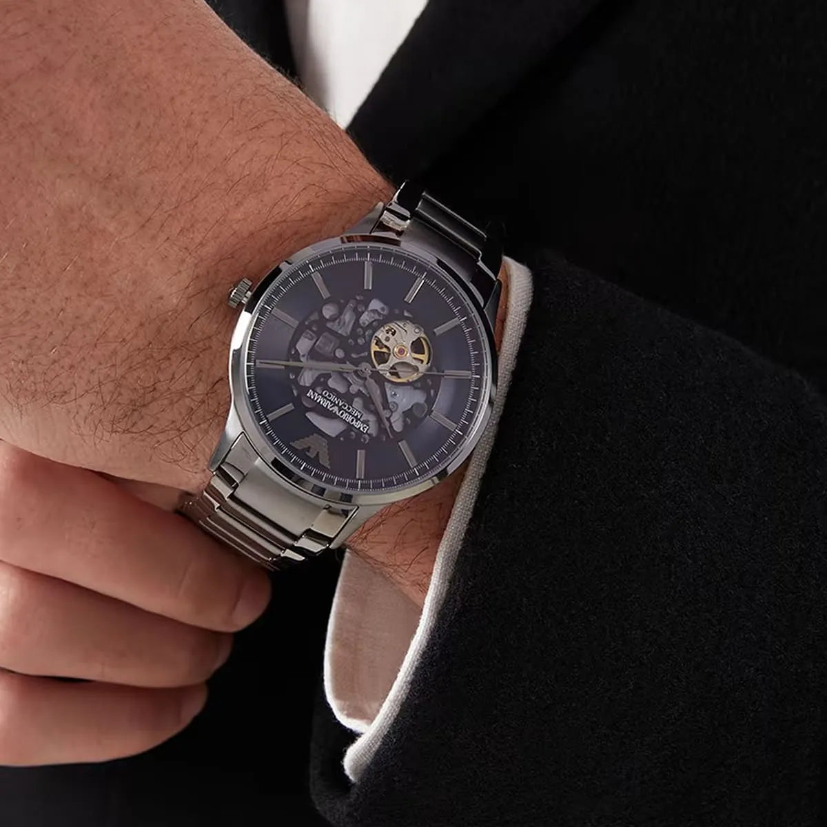 Emporio Armani Renato Meccanico automatic watch worn on wrist with blue dial visible