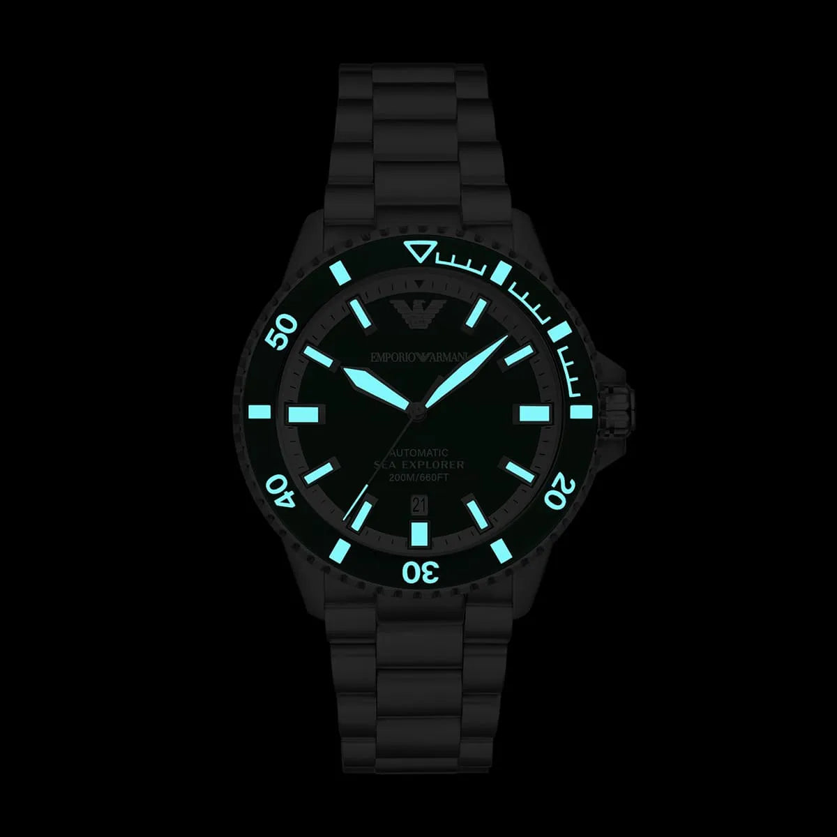 Sea Explorer watch with luminous dial and markers glowing against dark background