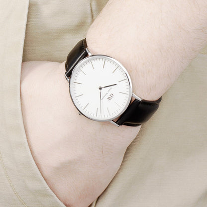 Daniel Wellington Sheffield 40mm watch worn on wrist, white dial and black leather strap visible