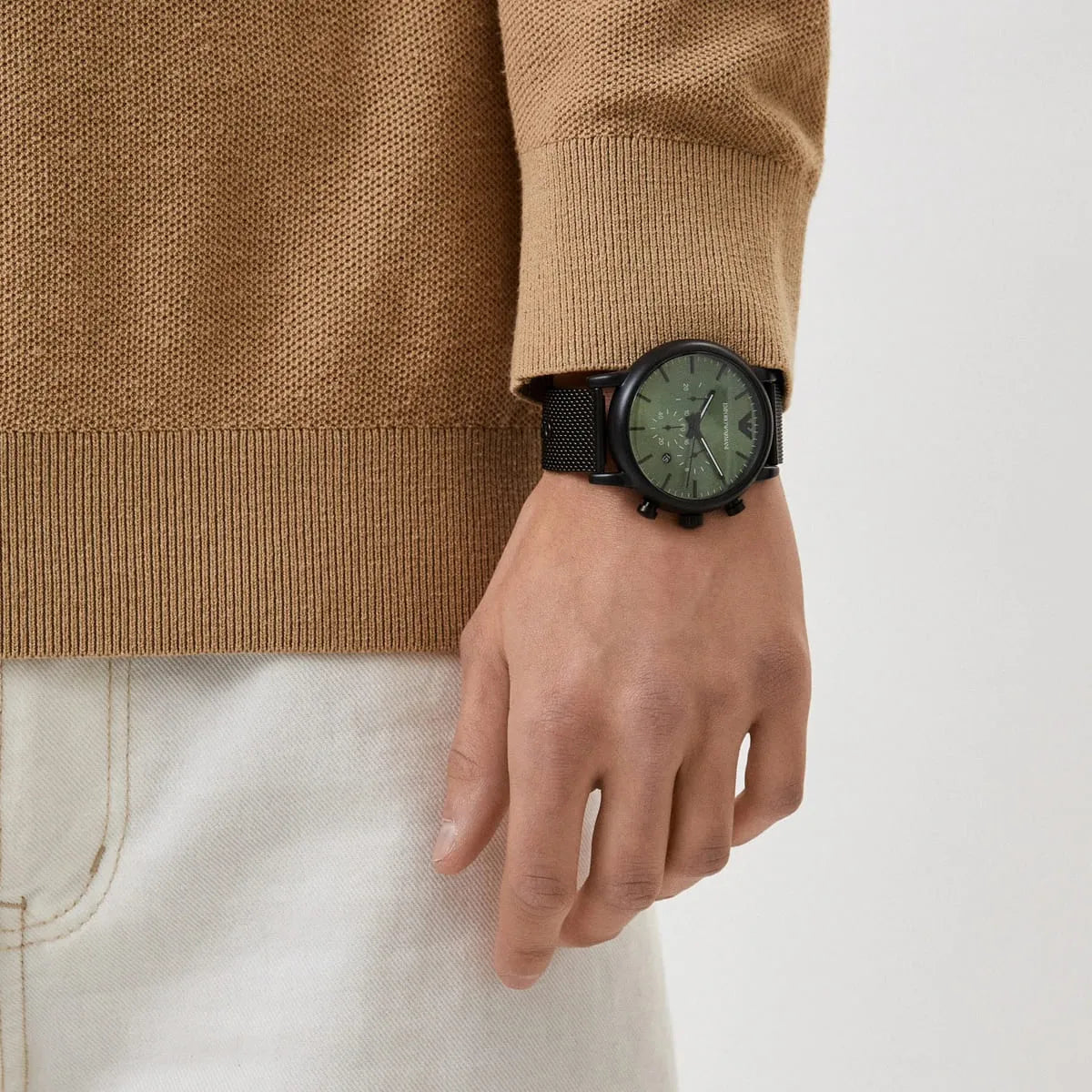 Emporio Armani AR11470 black chronograph watch worn on wrist with casual outfit