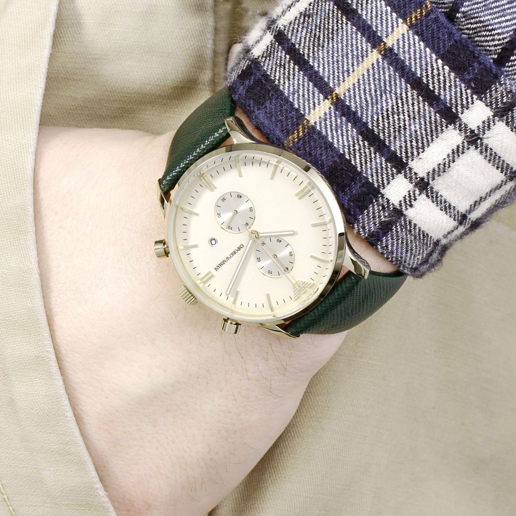 Emporio Armani AR1722 watch worn on wrist with green leather strap and cream dial display