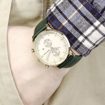 Emporio Armani AR1722 watch worn on wrist with green leather strap and cream dial display