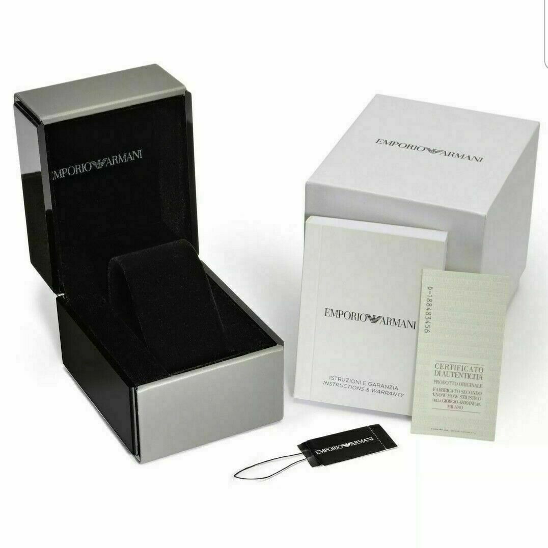 Emporio Armani AR5857 watch with branded box, documentation, and tags