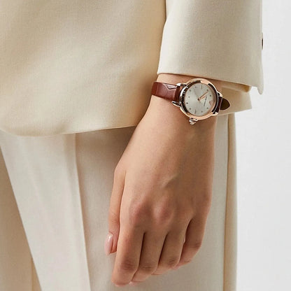 Emporio Armani Mia AR11525 watch worn on wrist with brown leather strap
