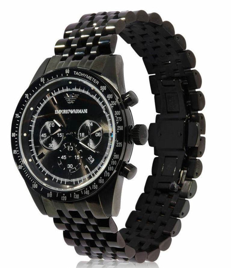 Emporio Armani Tazio AR5989 three-quarter view showing black chronograph watch with metal bracelet