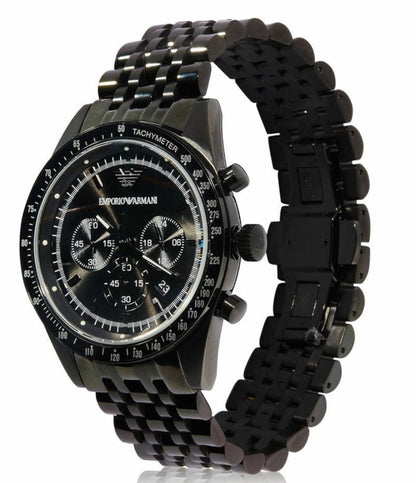 Emporio Armani Tazio AR5989 three-quarter view showing black chronograph watch with metal bracelet
