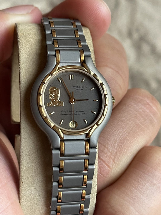 Two-tone steel women's watch with portrait dial held in hand