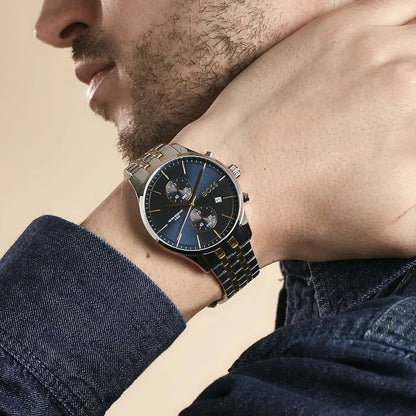 Hugo Boss Associate chronograph watch worn on wrist showing side profile and two-tone metal strap