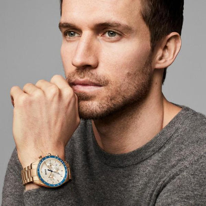 Hugo Boss Trophy chronograph watch worn on wrist, gold tone with blue bezel