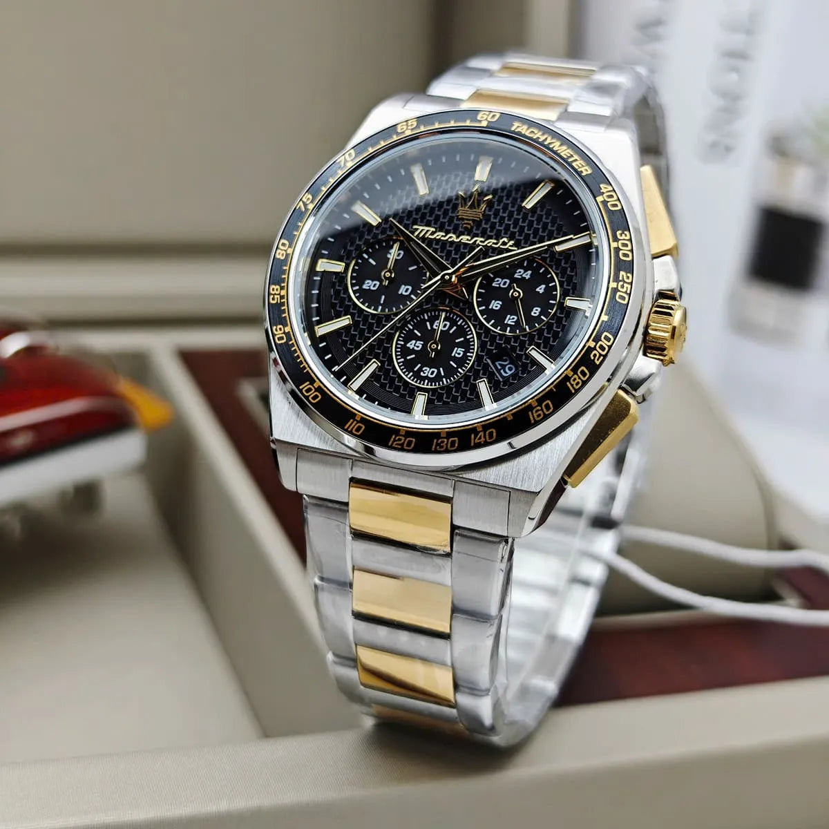 Maserati Velocità R8873652003 chronograph watch with black patterned dial and gold pushers