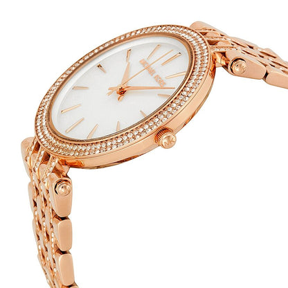 Michael Kors Darci watch side view showing crystal-set bezel and rose gold bracelet