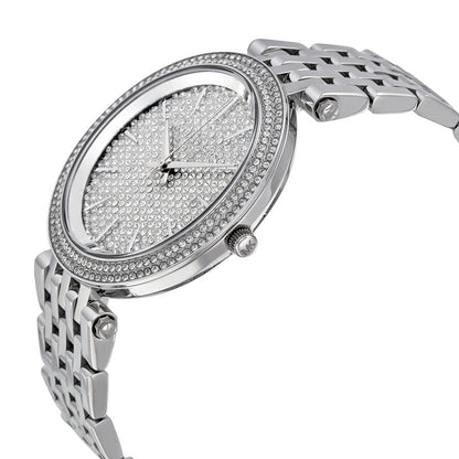 Angled view of Michael Kors Darci watch showing crystal dial and stainless steel bracelet