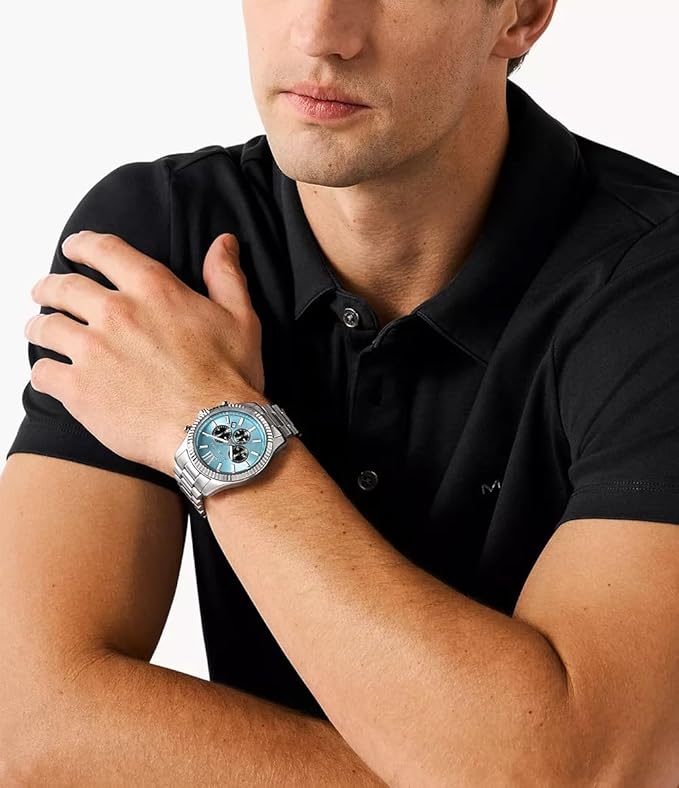 Michael Kors MK9165 silver chronograph watch worn on wrist with light blue dial