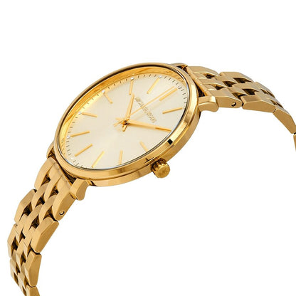 Side angle view of Michael Kors Pyper ladies watch showing cream dial and gold-tone bracelet