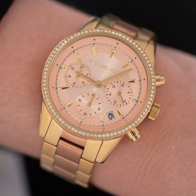 Michael Kors Ritz chronograph watch worn on wrist showing rose dial and bracelet