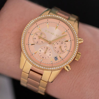 Michael Kors Ritz chronograph watch worn on wrist showing rose dial and bracelet