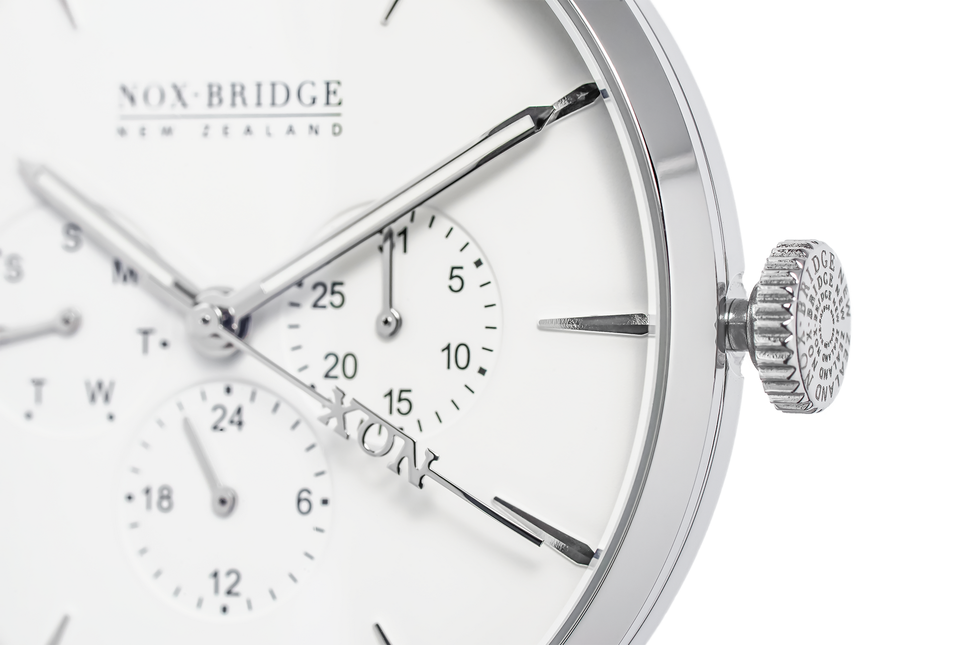 Close-up of Alcyone watch dial showing subdials, applied indices, and textured crown