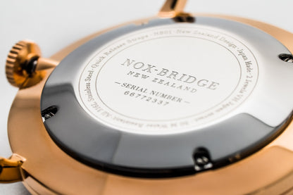 Noxbridge Classic Capella rose gold caseback showing serial number and engraved branding