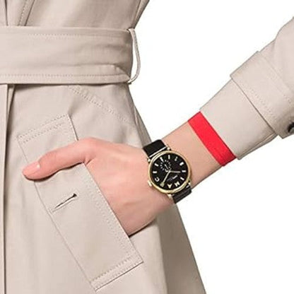 Marc by Marc Jacobs Baker MBM1269 watch worn on wrist with gold case and black dial visible