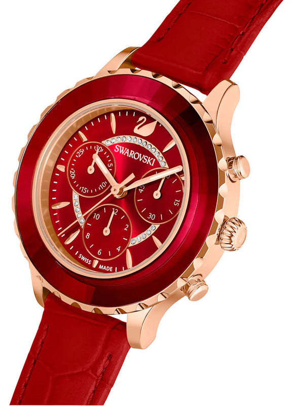Swarovski Octea Lux Chrono watch at angle showing red faceted bezel, dial, and strap