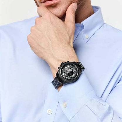 Tommy Hilfiger Damon chronograph watch worn on wrist with light blue dress shirt