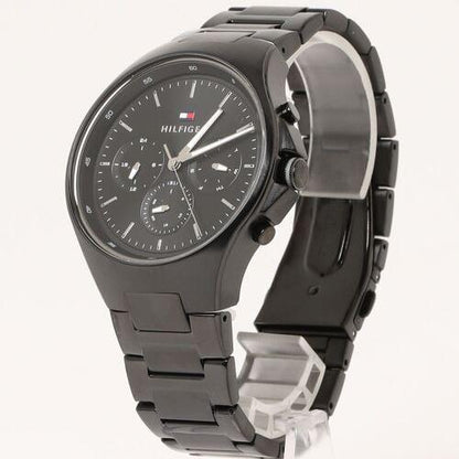 Tommy Hilfiger Justin black chronograph watch angled view with steel link bracelet