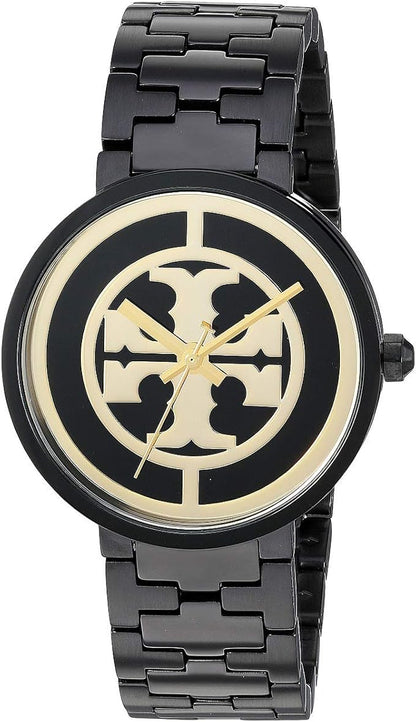 Angled view of Tory Burch Reva watch showing black case, gold Tory Burch logo dial, and black bracelet