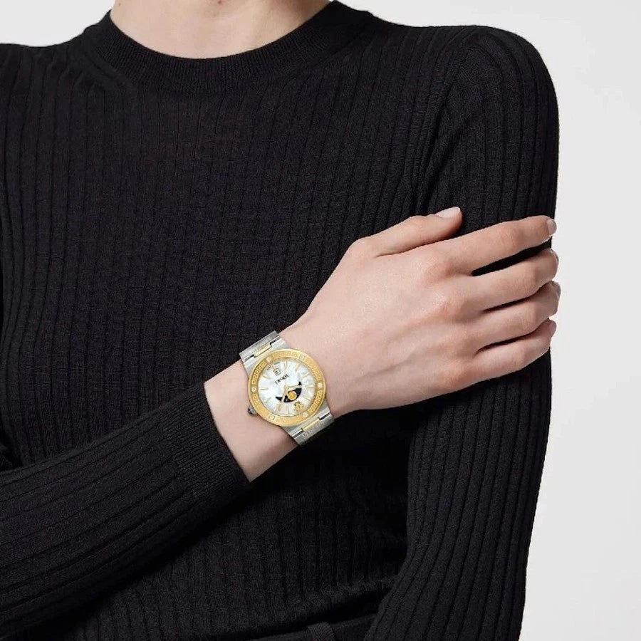 Versace Greca moonphase watch worn on wrist with two-tone bracelet