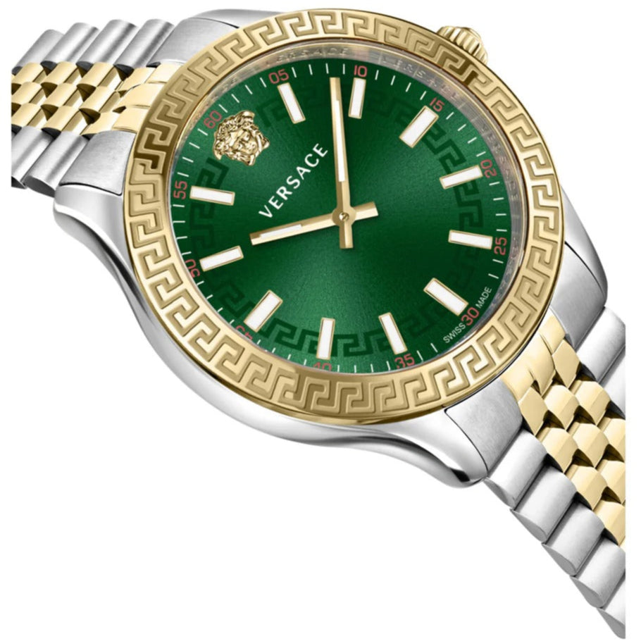 Angled view of Versace Hellenyium watch showing green dial with gold Greek key bezel and two-tone strap
