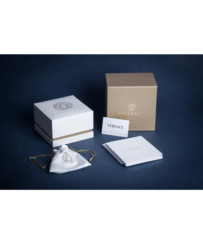 Versace jewelry set with packaging on a dark blue background