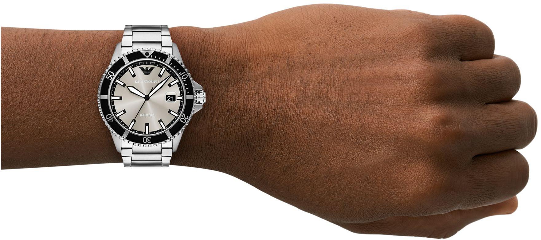 World Explorer stainless steel watch worn on wrist showing dial and bracelet fit
